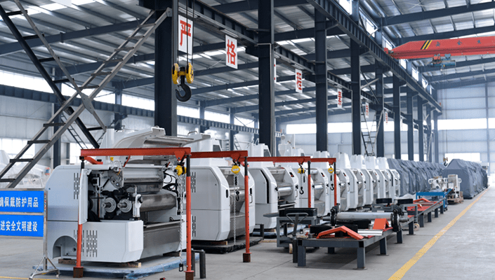 Row of assembled roller flour milling machines at Golden Grain Group manufacturing workshop